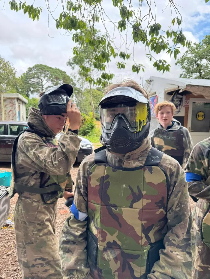 Explorers in camo gear at paintballing