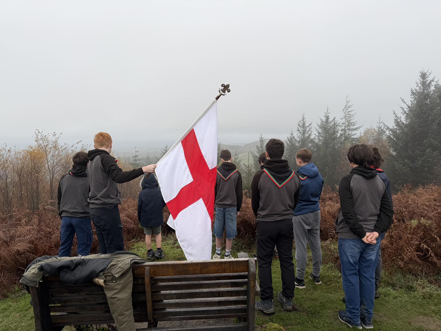 Triffid Explorers at a remembrance ceremony with the St George flag